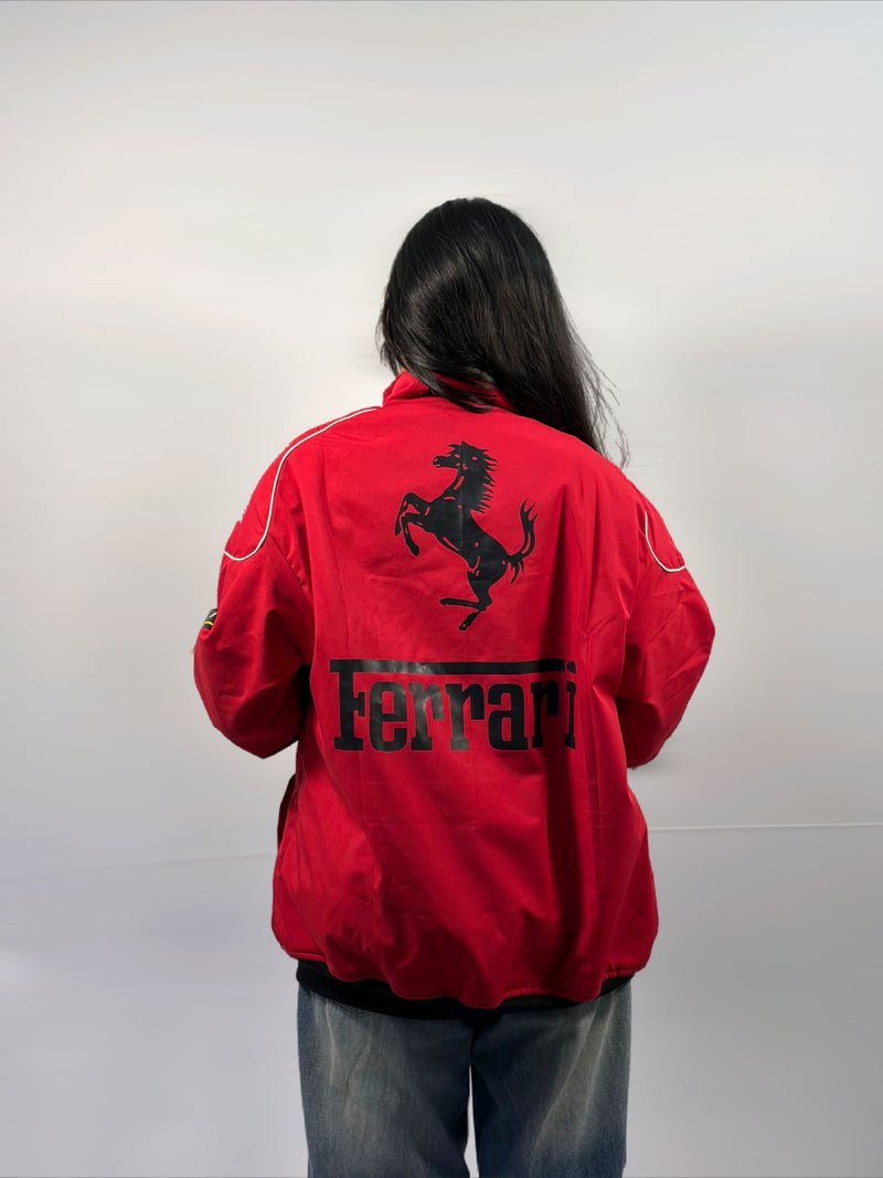 Red unisex puffer jacket with Ferrari F1 logo on back, full zip.
