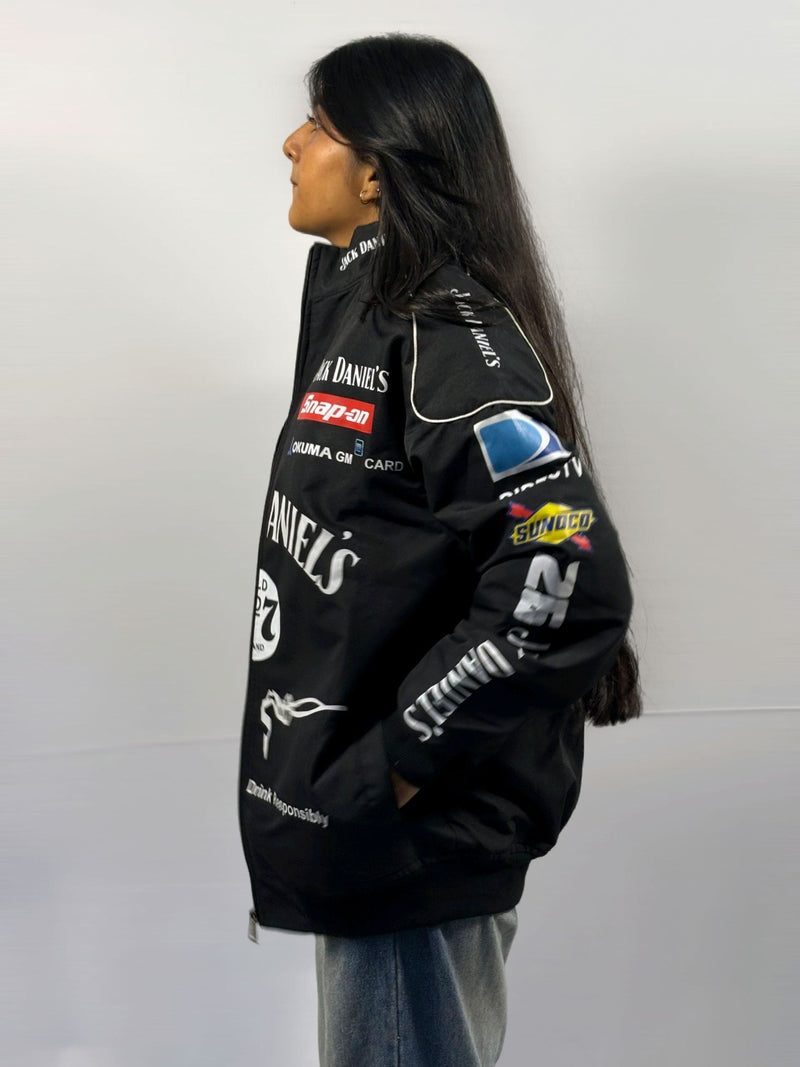 Black vintage racing jacket, side patch graphics on sleeves, zip front with stand collar