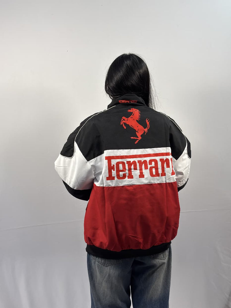 Unisex puffer jacket back view with black shoulders, red lower, and Ferrari logo
